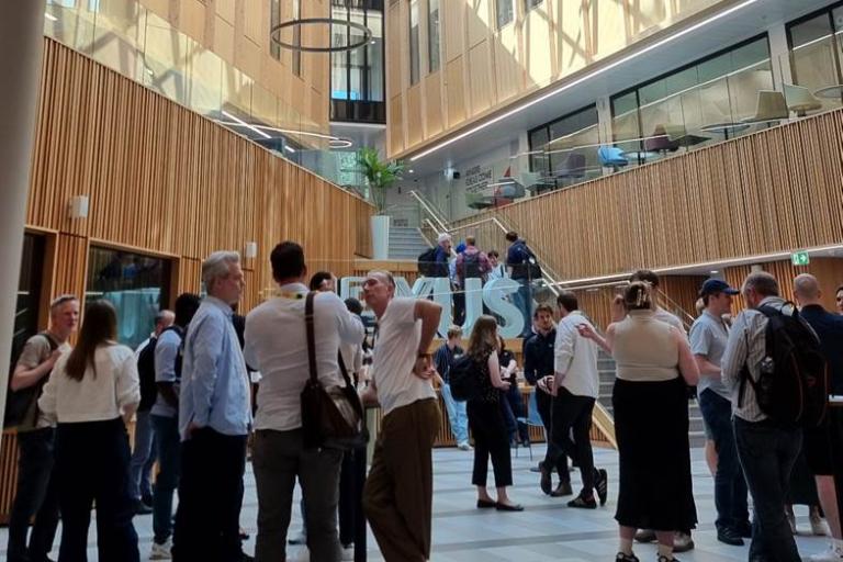 People networking in a large hall